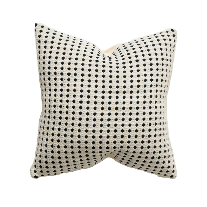 Woven decorative pillow with textured dot tufting