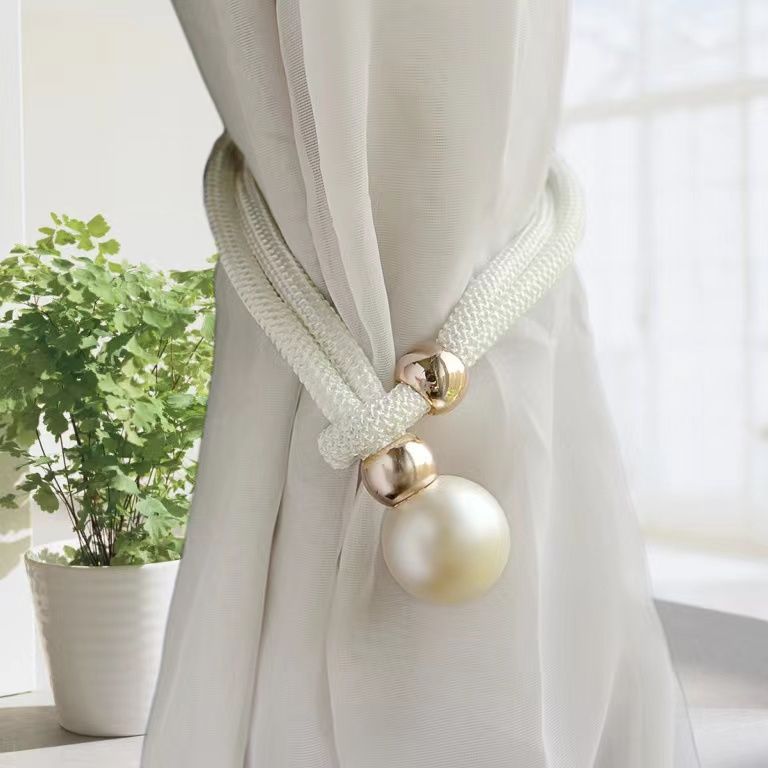 Elegant curtain tieback with decorative pearl