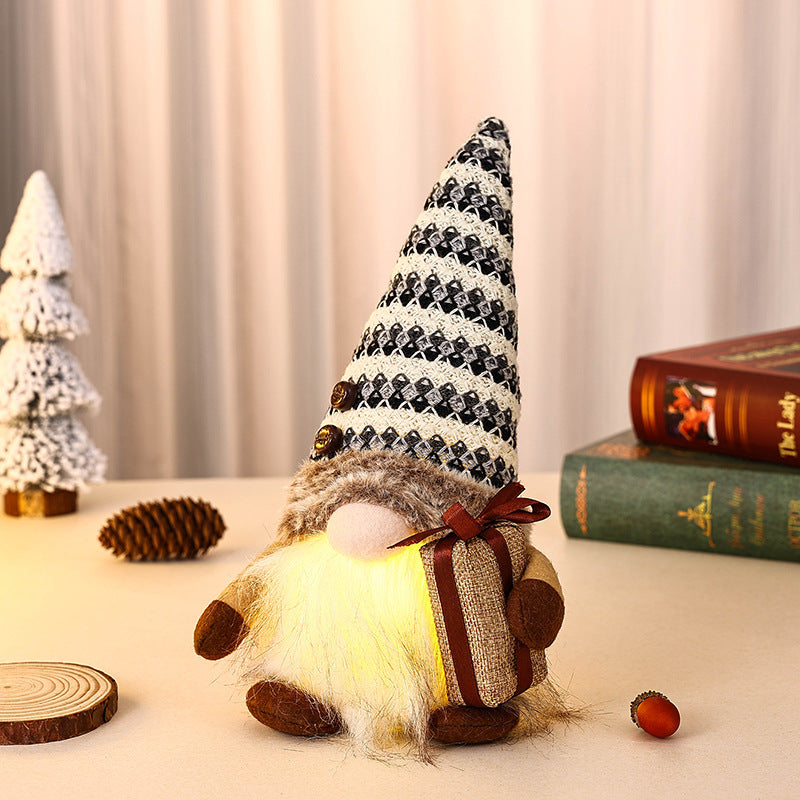 Decorative Christmas gnome with gift package
