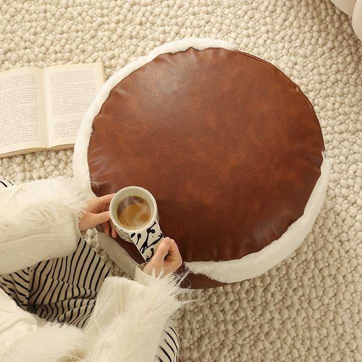 Round padded seat pouf as a floor stool with vintage leather look and teddy fleece inserts