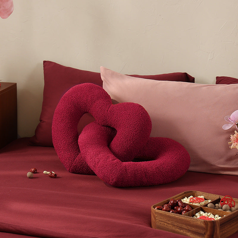 Braided heart cuddle pillow duo with bouclé cover and flexible filling