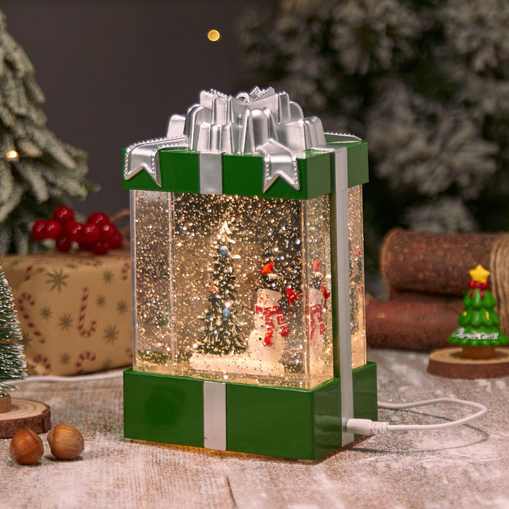 Illuminated Christmas lantern with snow and Christmas motif