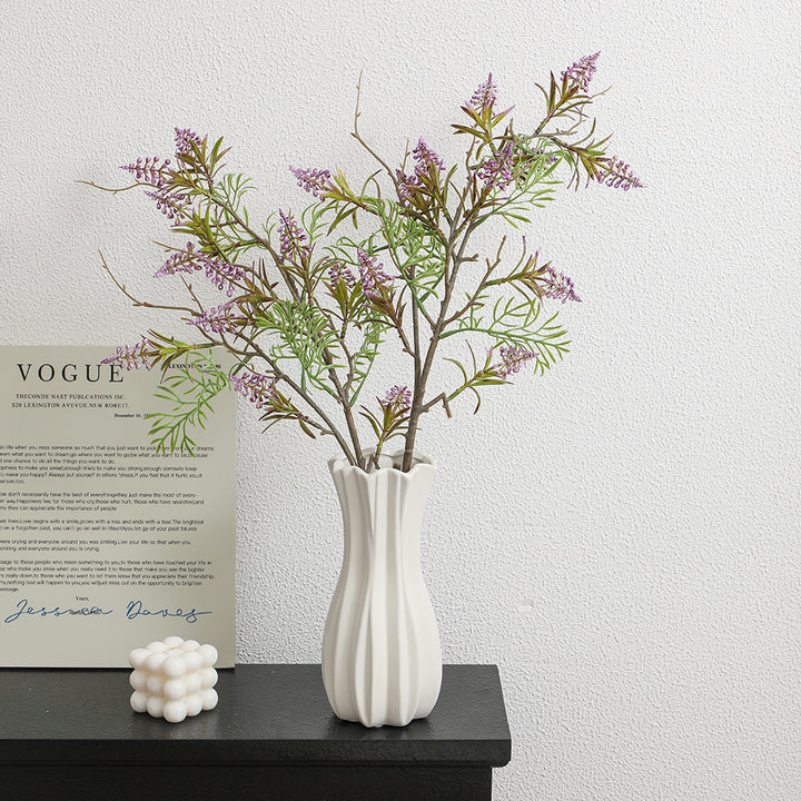 Artificial plant with decorative flowers