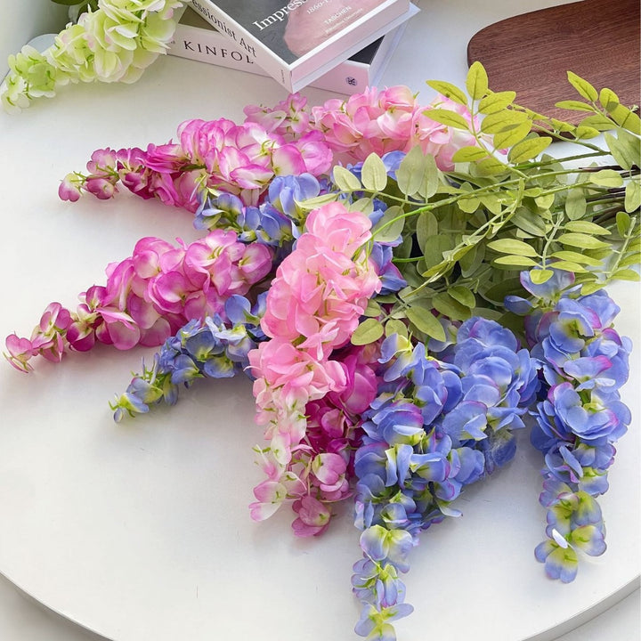 Artificial flower branch with lifelike, hanging flowers