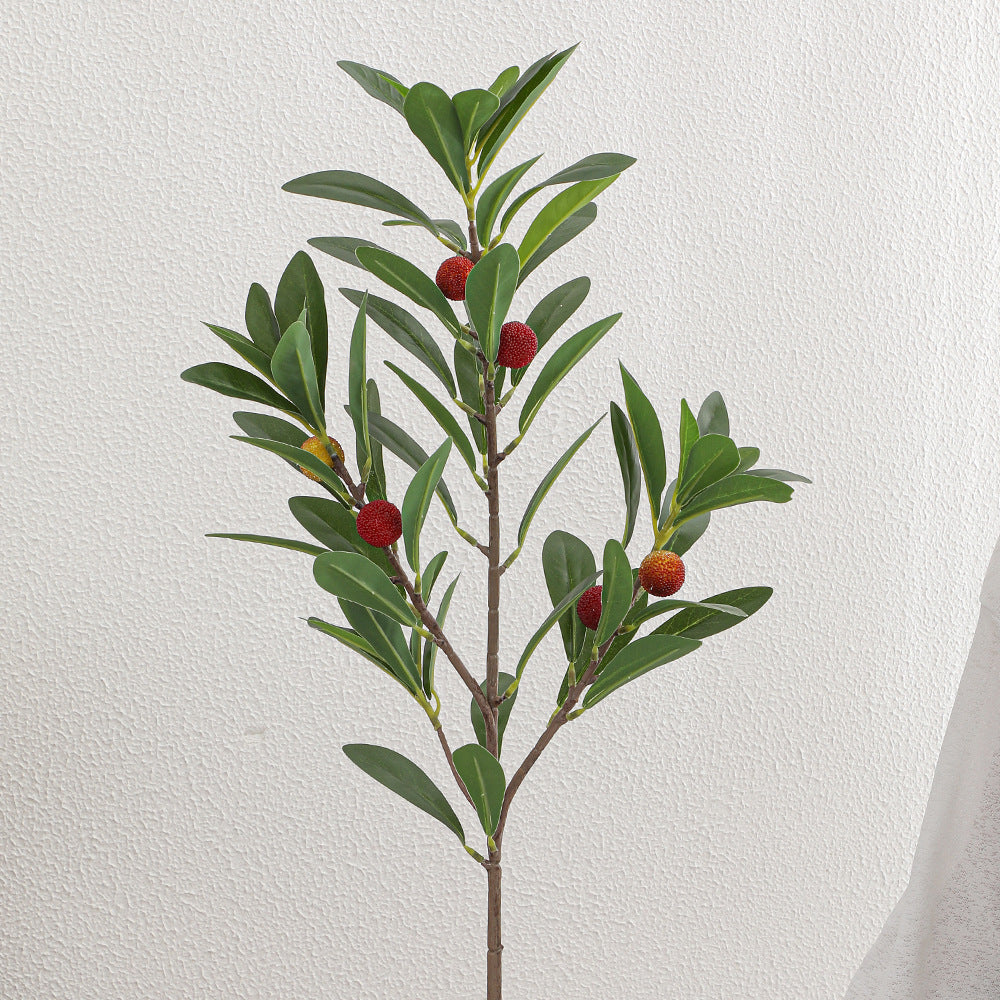 Artificial branch with decorative fruits