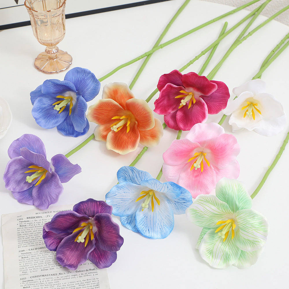 Artificial orchid flower branch with intricately detailed flowers