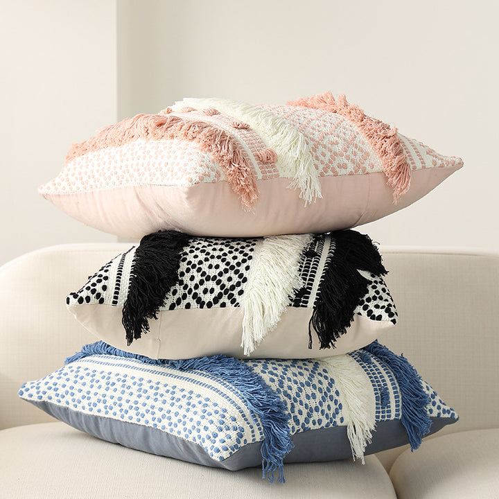 Textured Boho decorative pillow with fringes, tassels, and woven dot pattern