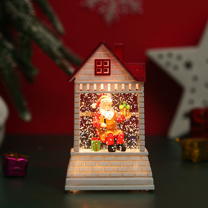 Illuminated Christmas village with moving figures